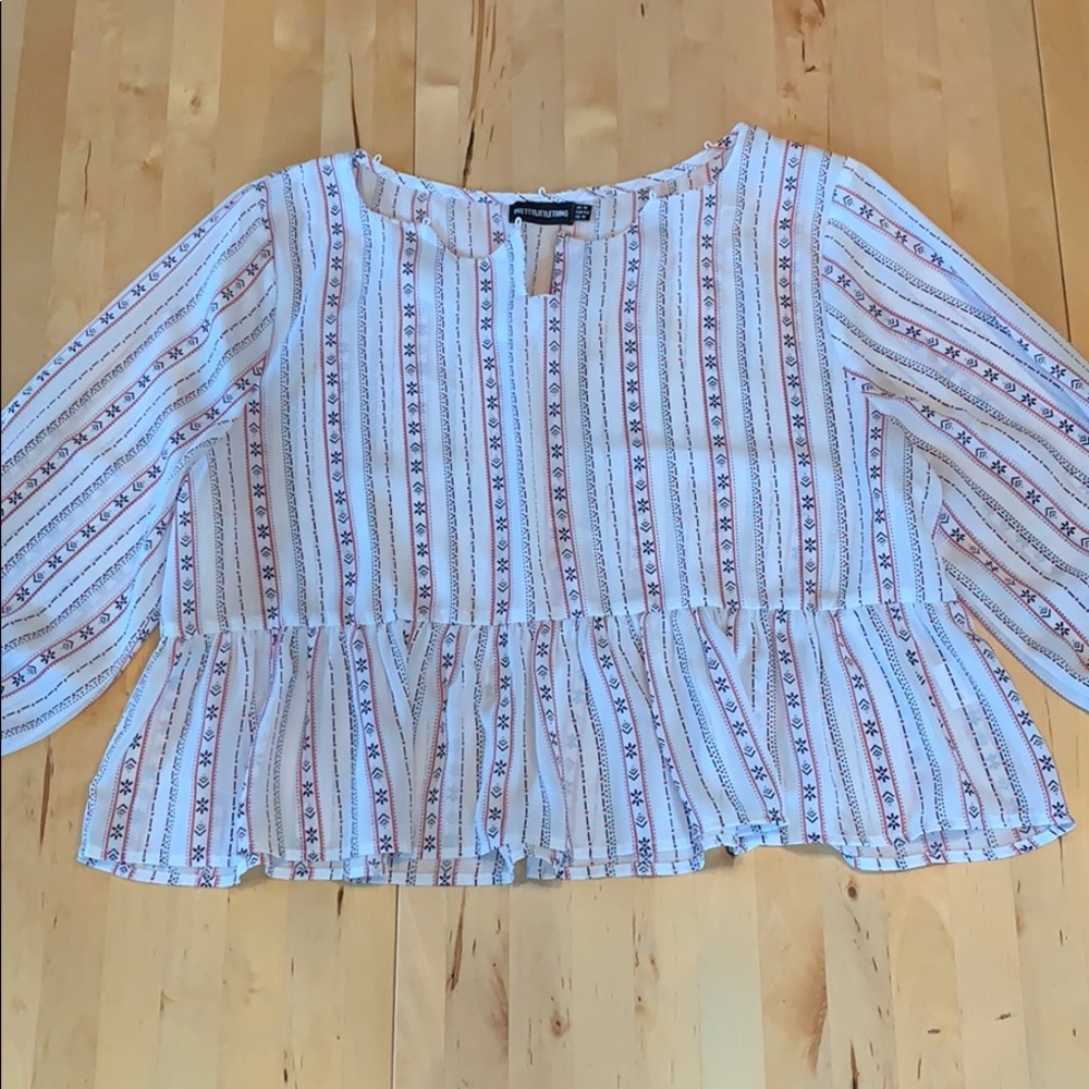 Patterned red, white, and blue blouse